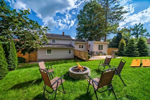 Relax Outdoors in the private fenced yard with firepit and cornhole