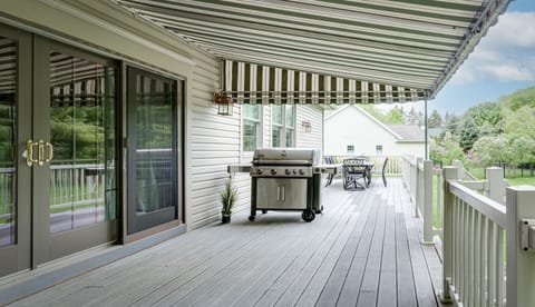 Back deck with grill and table and chairs