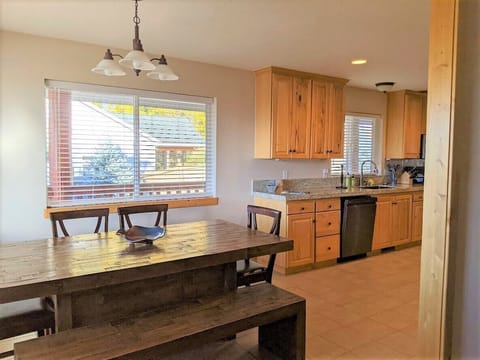 Plenty of room to extend the table for larger groups. Folding table and chairs are locted in lower level.