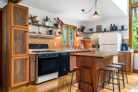Well appointed kitchen with all basic amenities including a coffee station, salt, pepper, olive oil spray, pots/pans, dishes, glassware, utensils, and a dishwasher.