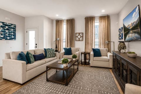 Level 2 lounge with ample seating and a Smart TV, perfect for movie nights, relaxing, and gathering together.