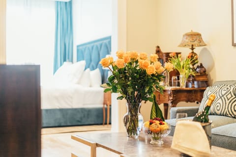 Superior King Suite | Living room | 47-inch flat-screen TV with cable channels, TV