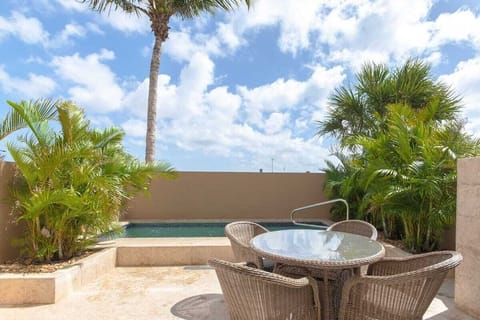 Private pool with table and chairs.