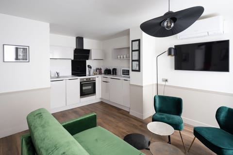 Deluxe Apartment | Private kitchen | Coffee/tea maker, electric kettle, highchair