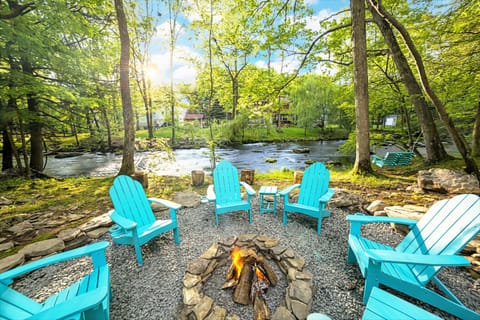 Welcome to the Poconos River House! Lounge streamside at the fire pit.