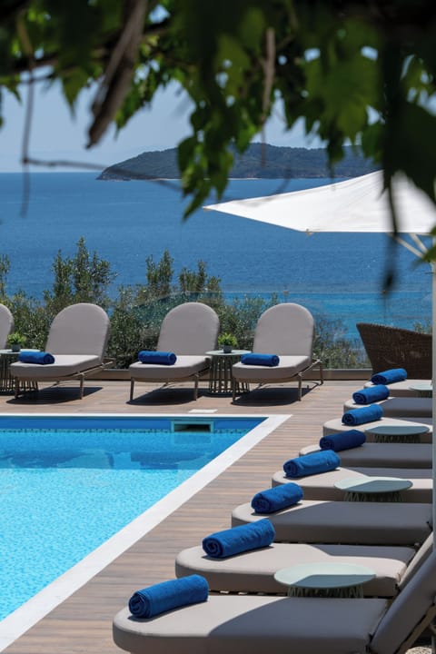 Outdoor pool, open 8:00 AM to 7:00 PM, pool umbrellas, sun loungers
