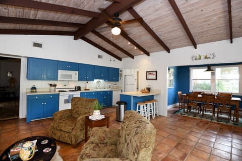The front living room opens to kitchen and dining room.