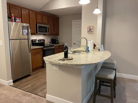 Kitchen with stainless steel appliances, granite countertops, and cabinets stocked with all the kitchenware. you could need.
