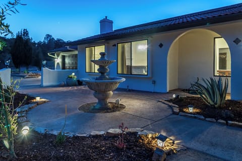Landscaped entry path with soft evening lighting