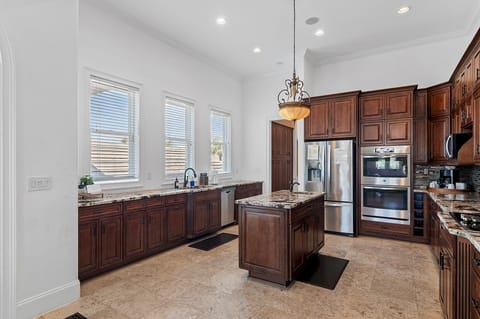 Kitchen island with prep sink and ample workspace