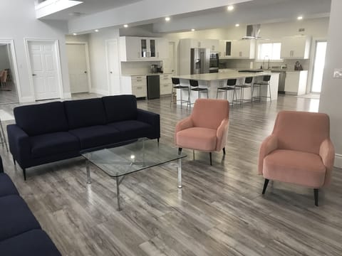 Seating area in the living room, kitchen and dry bar area. 