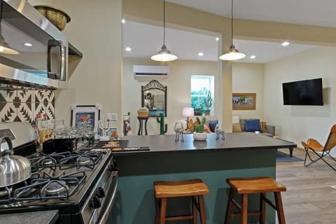 Kitchen with seating on both sides of breakfast bar