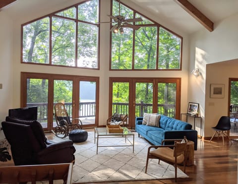 Bright spacious living room features spectacular view, comfy furniture, smart TV