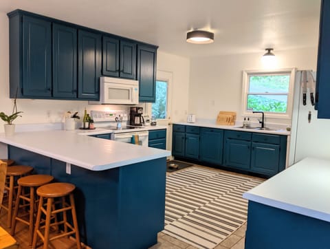 Beautiful full-size family kitchen with breakfast bar