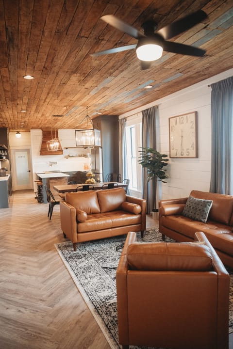 Relax on the leather sofa set in the living room.