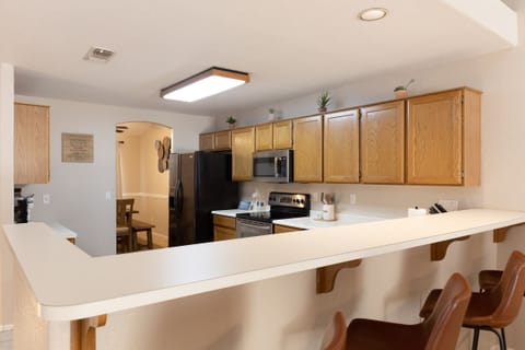 Plentiful kitchen space; well stocked with essentials for prepping and cooking.