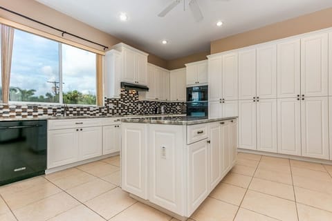 Chef's Setup: Newly renovated with modern appliances, ample counter space, and plenty of storage for a month's worth of groceries.