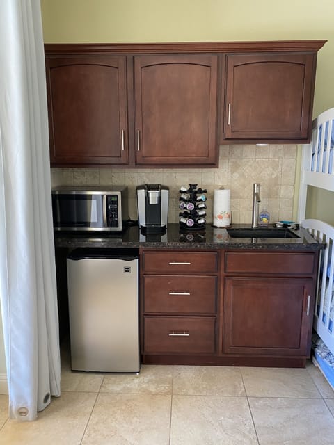 1st floor large bedroom comes with its own mini fridge, wetbar, and Keurig.