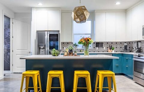 Open-Concept Kitchen, Fully Equipped With Natural Lighting.