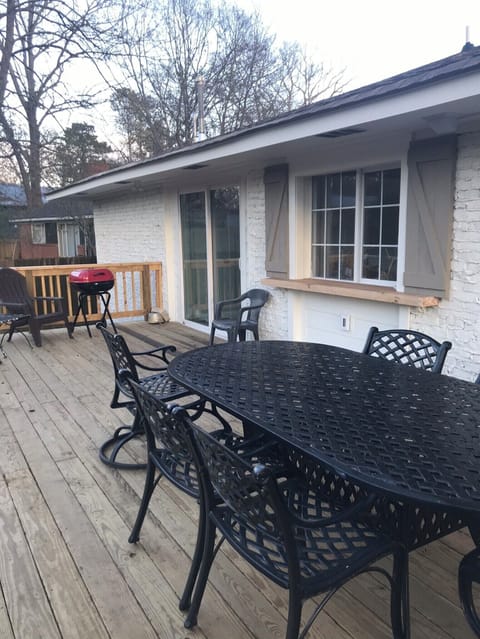 Deck with gas grill and charcoal grill. Pass-thru kitchen window.  