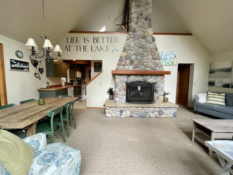 living room, view of loft and river rock fireplace