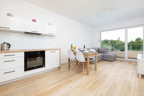 Open-plan kitchen with dining space and modern appliances