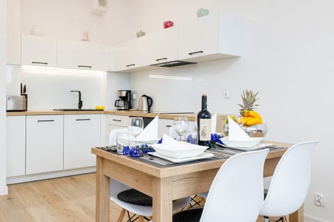 Beautifully set dining table with wine and decorations