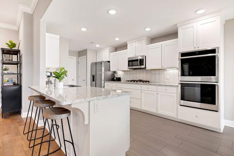 Our large, open kitchen stocked with all necessary amenities for baking or cooking during your stay.