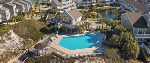 Splash into the beachfront pool with the Gulf of Mexico just steps beyond — this is the rare setup that earns its own booking.
