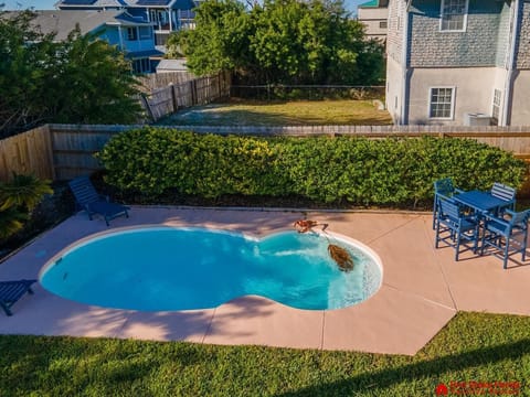 Private backyard pool with cozy seating for relaxation