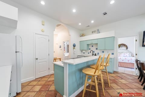 Bright, airy kitchen with cozy breakfast bar seating