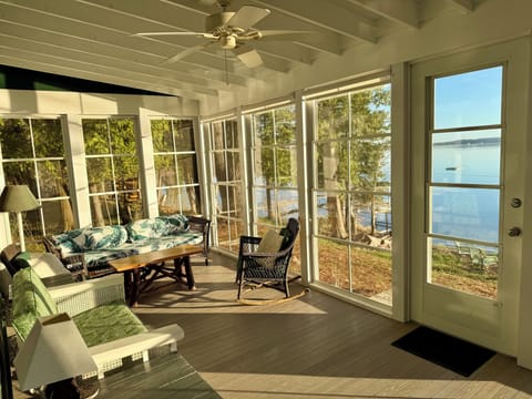 Screened porch overlooking the lake — a favorite place to gather.