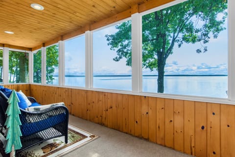 The shared screened porch connects the master suite and queen suite
