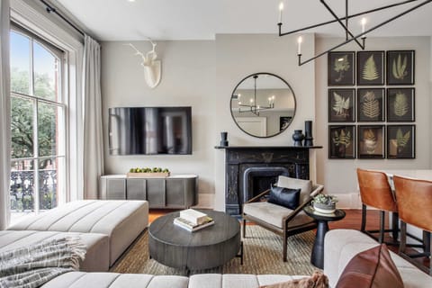 Living Room 1 | Open Layout View with TV and Fireplace | Unit 3 — Third Floor of Building — Unit on One Level