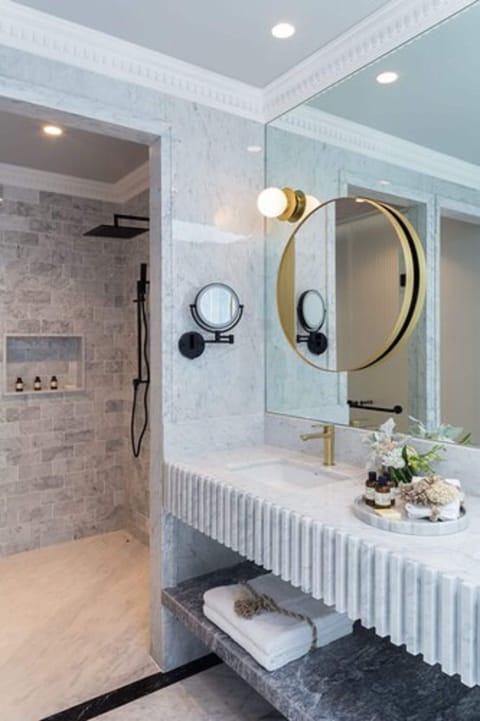 Designer toiletries, hair dryer, bathrobes, slippers