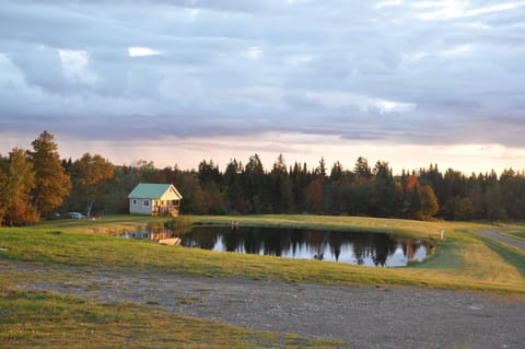 The cabin bathed in the pink light and stillness of the morning