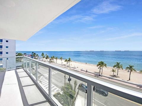 a view of the beach from the condo's balcony.
