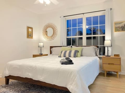 Master bedroom with a king bed, 55 inch TV and private bathroom