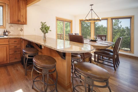 Dining area with panoramic forest views