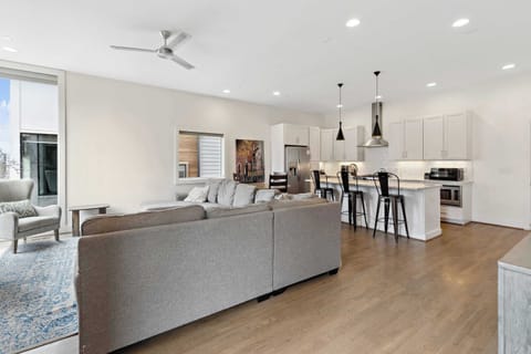 Level 1 features an open-concept layout connecting the kitchen, dining, and living areas for easy gathering and entertaining.
