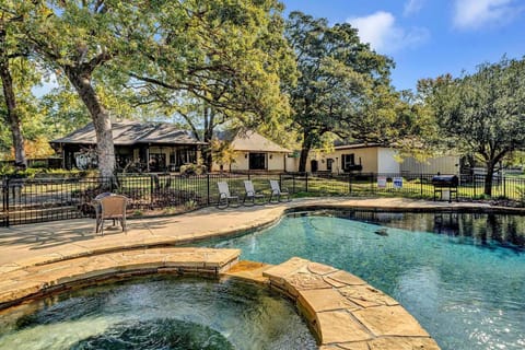 Pool, spa and fire pit.  Backyard is canopied by huge oak trees.