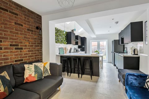 Living room (with Smart TV and Netflix) and a fully equipped kitchen with fridge freezer, oven, stove, microwave, kettle, toaster, dishwasher, cookware, tableware, and utensils all provided