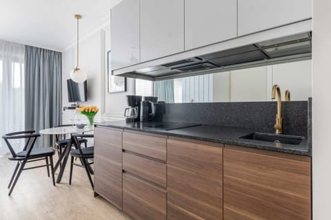 Functional kitchen with wooden cabinets and modern appliances.

