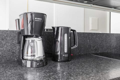 Coffee and tea corner with modern equipment for your convenience.