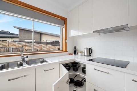 Modern Kitchen with modern appliances including microwave, dishwasher and rice cooker.