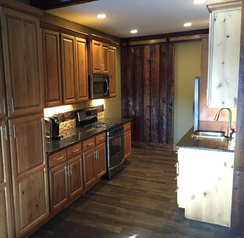 Kitchen - behind the barn door leads to the bunk room!