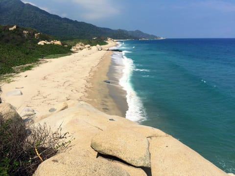 Beach nearby, white sand, sun loungers