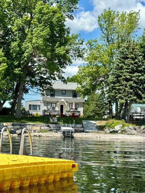 yellow floating swim raft (weather permitting) just off dock