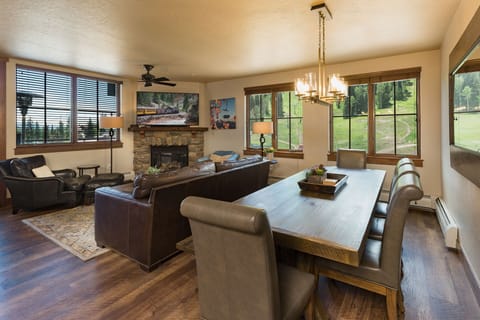 Main Living and Dining Spaces (Gas Fireplace, TV and Deck).  New hard wood floors
