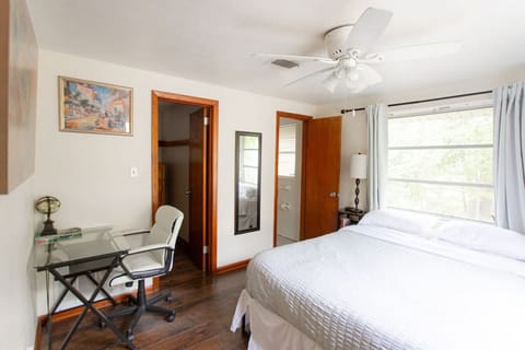 Cozy bedroom with small desk for remote working